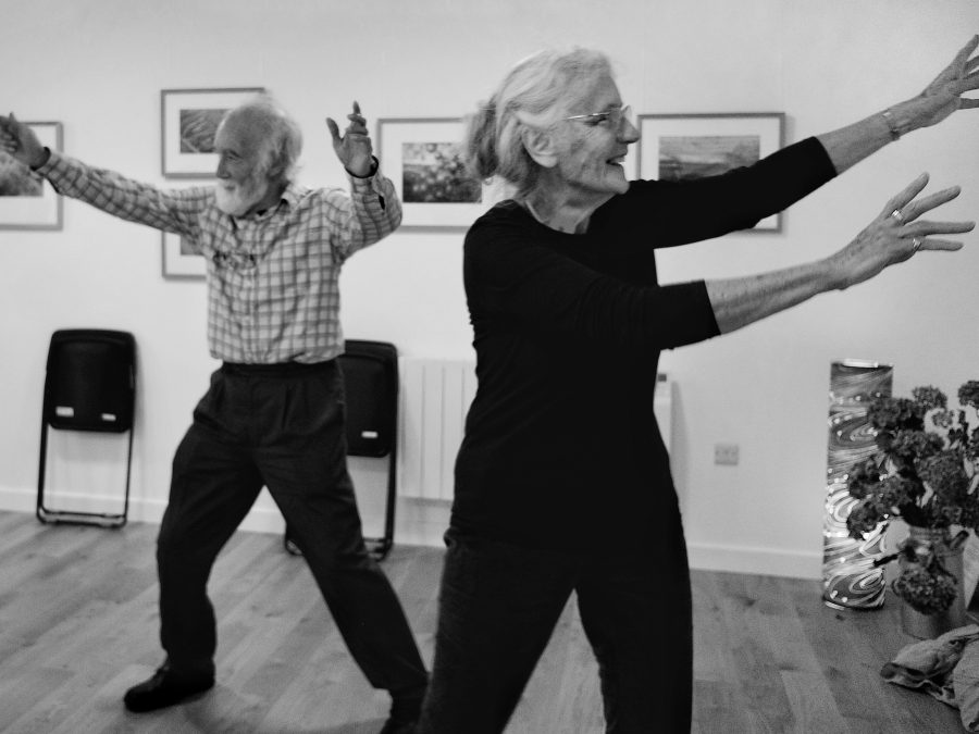 two members of the Falling on your Feet dancing together, with big wide smiles