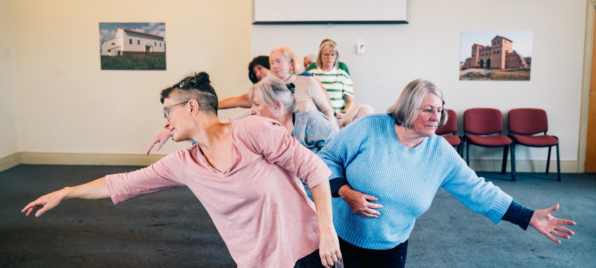 Creative Health dancing workshop with the Falling on Your Feet participants doing contemporary dance shapes.